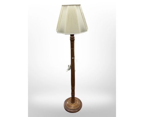 A contemporary turned wooden standard lamp, height 171 cm 
