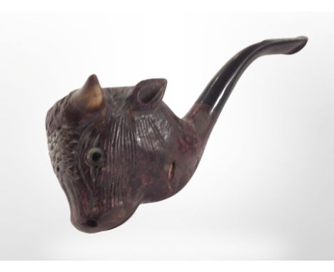 A vintage smoking pipe with bull's head bowl.