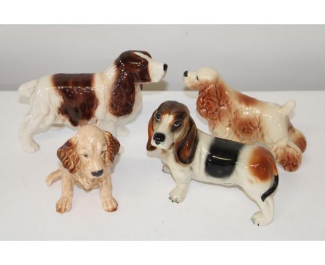 Four ceramic dog figures (two Sylvac) 