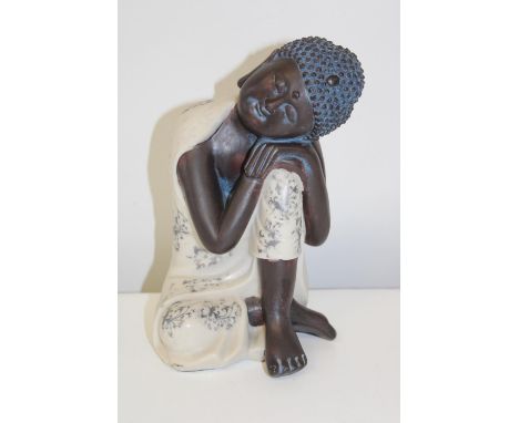 A ceramic Budha figureh24cm 