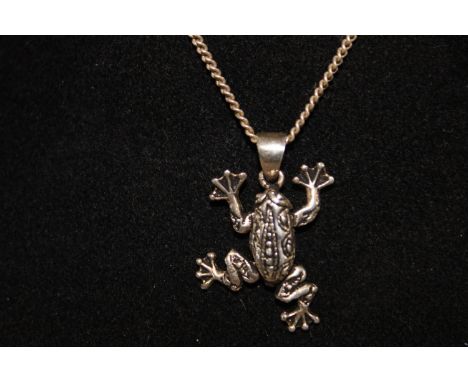 A Sterling silver chain with an articulated frog pendant 