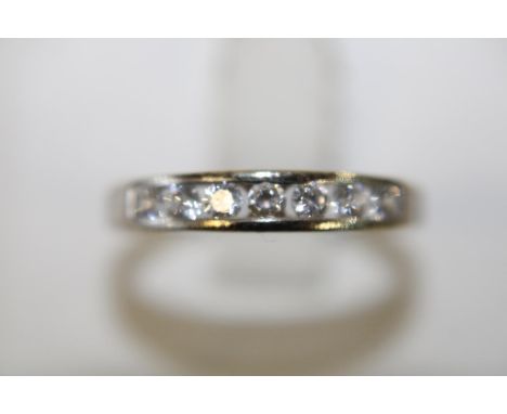 A 9ct white gold channel set ring size N 