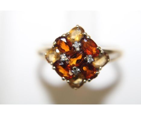 A 9ct gold ring set with topaz, citrine &amp; diamond size R 