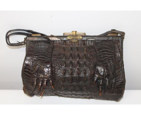 A vintage crocodile skin handbag 