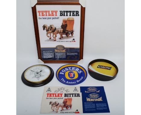 A collection of brewery memorabilia, to include a Tetley's Ales wall clock, a framed Tetley print, drinks trays and beer soak
