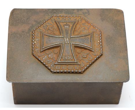 A WWI German metal box with an Iron Cross second class design to the lid, 12 x 9 x 6cm, containing various British Forces clo