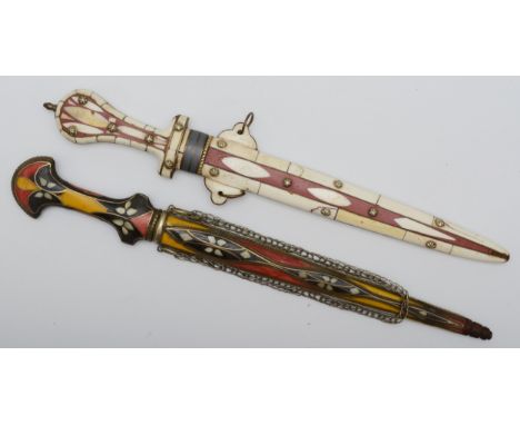 A Moroccan bone and resin dagger, with 31cm blade and another with wirework and resin decoration (2).This bladed product is n