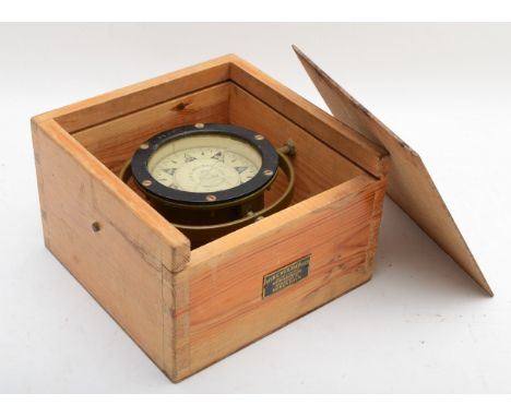 An early 20th century brass marine compass by Iver C. Weilbach &amp; Co, fitted to wooden case. 