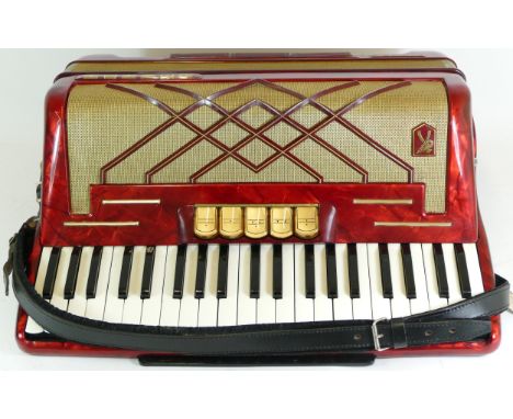 A cased Hohner Virtuola II piano accordion, circa 1960s. 