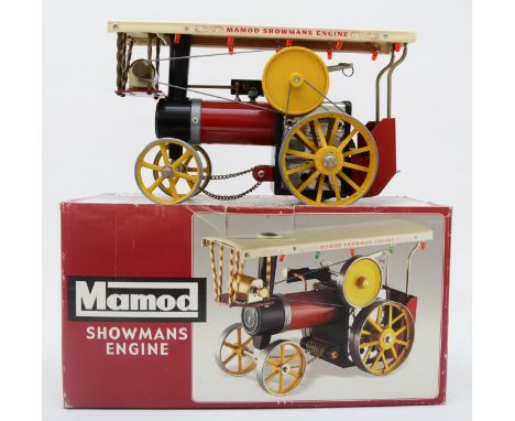 A Mamod live steam Showmans engine, maroon body with cream canopy, yellow spoked wheels and yellow flywheel, boxed with steer