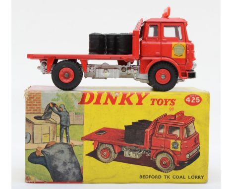 A Dinky 425 Bedford TK Coal Lorry "Hall &amp; Co" having red cab, silver trim, blue interior with 6 coal sacks and red plasti