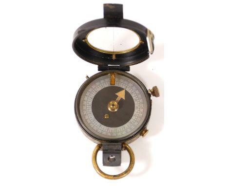 WWI, a British Army brass compass, dated 1917, with leather pouch 