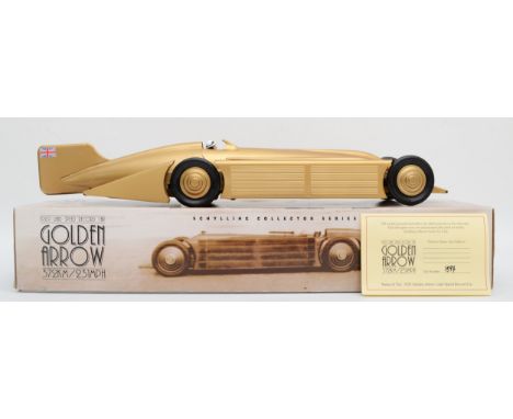 A tinplate model by Schylling, part of their Collector Series, of the Golden Arrow, which set the land speed record in 1929, 