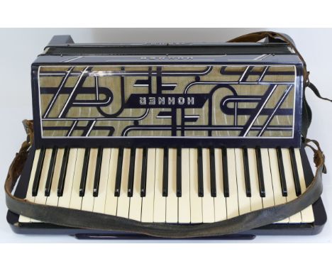 A cased Hohner Verdi III piano accordion. 