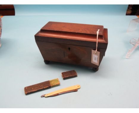 An early 19th century mahogany tea caddy, sarcophagus-shape with gilt-brass lion-mask ring handles, 12in., and an early cut-t
