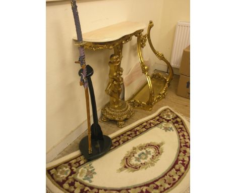 Two period French-style moulded gilt console tables, one with figural stem, marble tops, and an Indian claret and cream heart