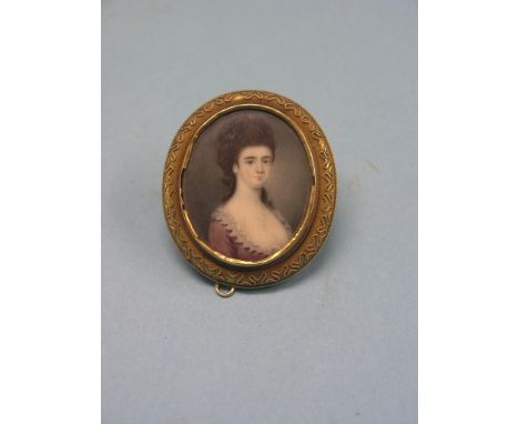 A yellow metal brooch, oval-shape with inset late Georgian portrait miniature on ivory, young female sitter