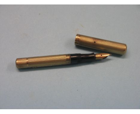 A Waterman's 9ct. gold fountain pen, lever-filling with engine-turned detail