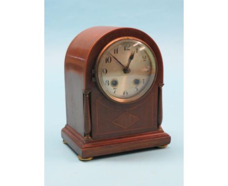 An Edwardian inlaid mahogany mantel clock, dome-shape with French gong-striking movement, with key and pendulum, 8in. 