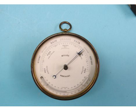 A late Victorian aneroid barometer, printed enamel dial signed Miller, Worthing, brass case, 4.75in., also to include a croco