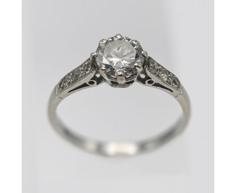 A platinum diamond solitaire ring set with further diamonds to the shoulders, approx 0.75ct centre stone, size K.