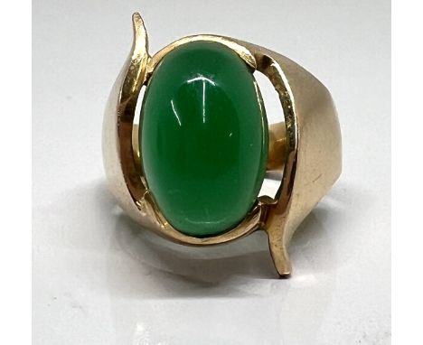 A gold and jade stone ring (not marked), size K/L, approx 9.9g.