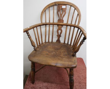 19th C elm stick back Windsor armchair on turned supports, with crinoline understretcher 