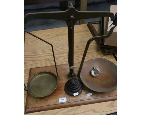 Pair of early - mid 20th C brass balance scales by S. Parsons Bradford, with a set of graduating cast metal weights, on recta