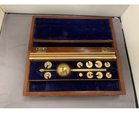 A BRASS SIKES HYDROMETER IN A MAHOGANY CASE