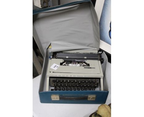 A VINTAGE OLIVETTI 'DORA' TYPEWRITER WITH CASE