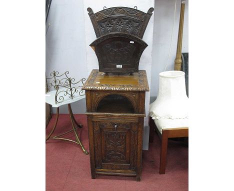 Early XX Century Carved purdonium, the top with scroll decoration, fall front with a carved panel, on style supports, sides w