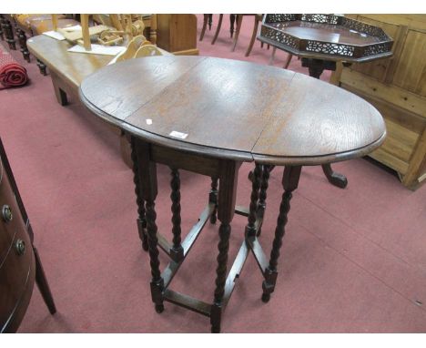 1930 Oak Gate Leg Table, with drop leaves, on barley twist and block supports, united by stretchers, 75cm.