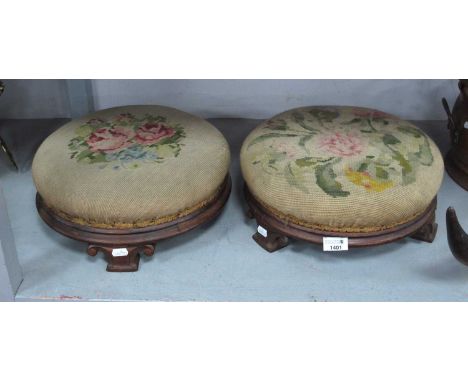 Pair of XIX Century Mahogany Circular Footstools, each on three scroll feet, with tapestry tops, 35cm wide,