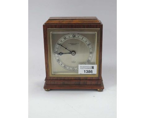 XX Century Elliott Oak Cased Mantel Clock, with a silver chapter ring, Roman numerals on brass bun feet, 12cm wide.