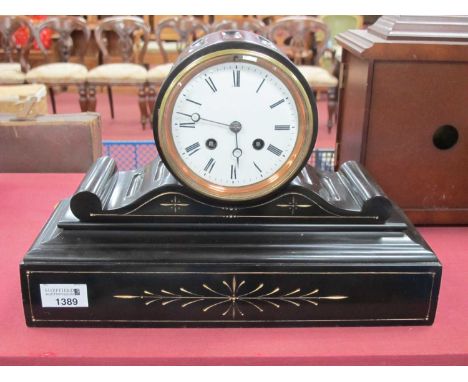 XIX Century Black Slate Mantel Clock, with a circular enamel dial, Roman numerals, on a plinth base, with engraved decoration