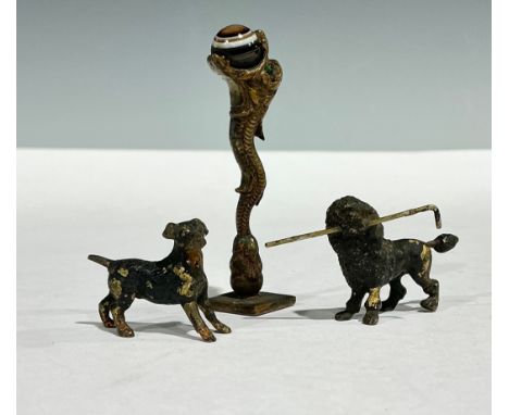 A 19th century bronze and banded agate desk seal, as a Chinese dragon holding a ball, four-leaf clover intaglio matrix, 6.5cm