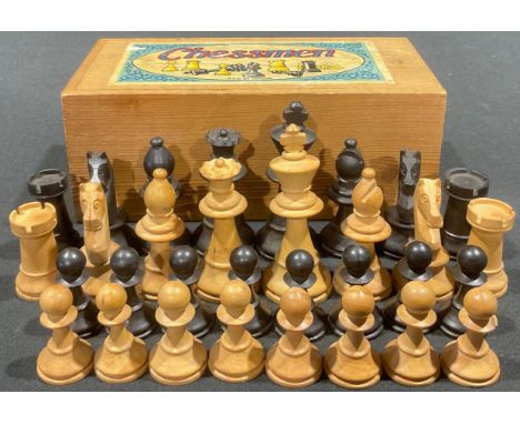 A boxwood and ebonised chess set, by K&amp;C Ltd, London, pine box, paper label