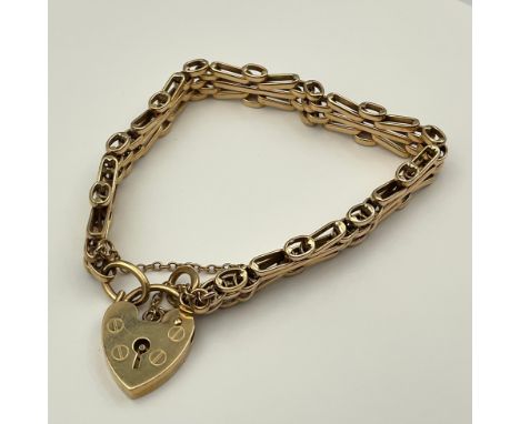 A Ladies 9ct Gold Gate Bracelet; stamped "375" on the fastening link and stamped "375" on the heart shaped padlock,max width 