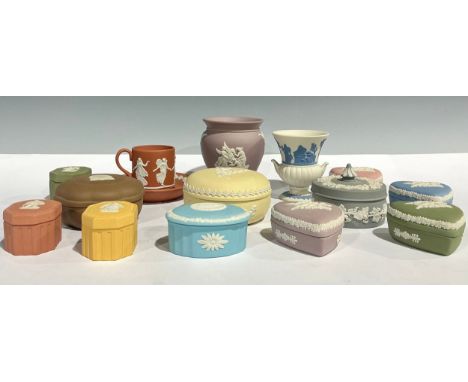 A set of four Wedgwood Jasperware love heart shaped trinket pots and covers, in lilac, pink, pale blue and sage green colourw