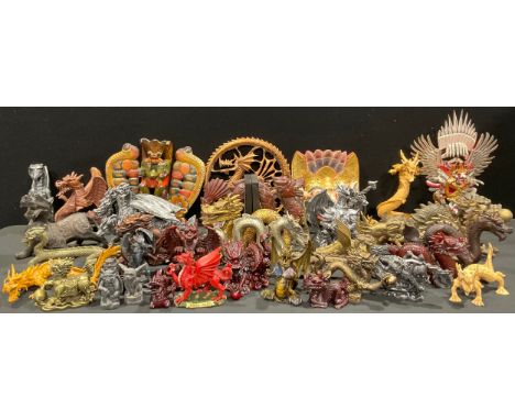 A collection of model dragons, including brass, resin, wood, etc, various sizes and styles, the largest 42.5cm long; Raksha m