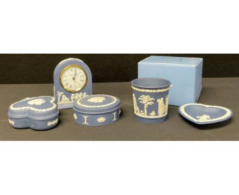 A Wedgwood Portland blue Jasper miniature mantel clock, 12cm, impressed mark, boxed; a Portland blue Jasperware club shaped t