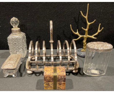 An Edwardian silver mounted rounded rectangular cut glass dressing table jar, the cover embossed with foliate scrolls, 8cm wi