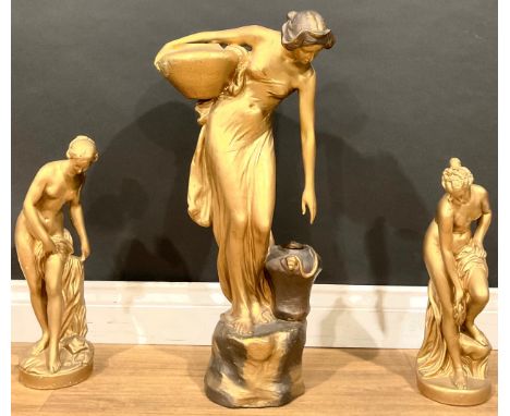 Interior Decoration - an Art Nouveau Goldscheider terracotta figure, of a water carrier, 65cm high, painted gold, marks to ve
