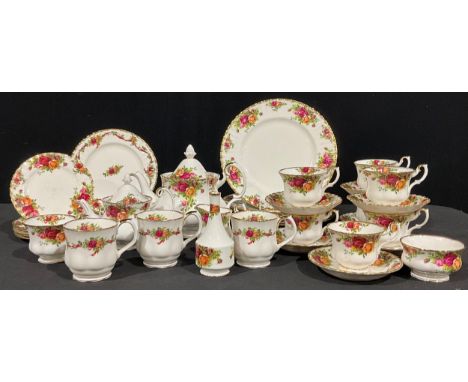 A Royal Albert Old Country Roses pattern dinner and tea service for six, including dinner plates, side plates, teapot, bachel