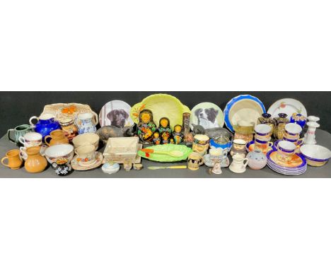 A Bretby model, of a cat with cotton reel, no. 2230; another, cat with ball of wool, no. 1518; Carlton Ware leaf dishes; a Th