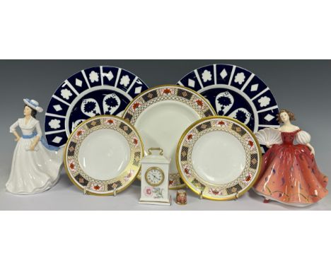 A Royal Doulton figure, First Waltz HN5093; another, Margaret HN4927; a Royal Crown Derby 'Derby Border' side plate, 22cm dia