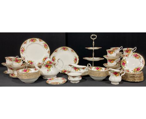 A Royal Albert Old Country Roses pattern dinner and tea service, comprising teapot and cover on stand, three tier cake stand,