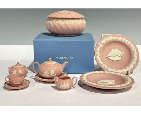 A Wedgwood pink Jasperware miniature tea set, comprising teapot, sucrier and cover, milk jug, teacup, saucer and tea plate; a