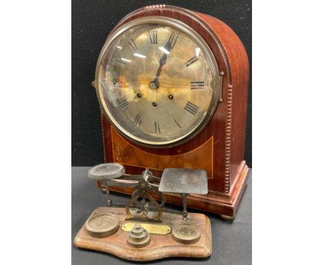 An early 20th century arched top mantel clock, Roman numerals on silvered circular dial, Gustav Becker movement, triple windi