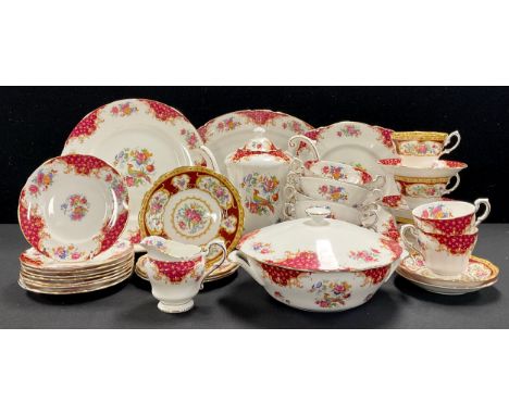 A Paragon Rockingham pattern coffee pot, vegetable dish and cover, milk jug, bread and butter plate, milk jug, two dinner pla